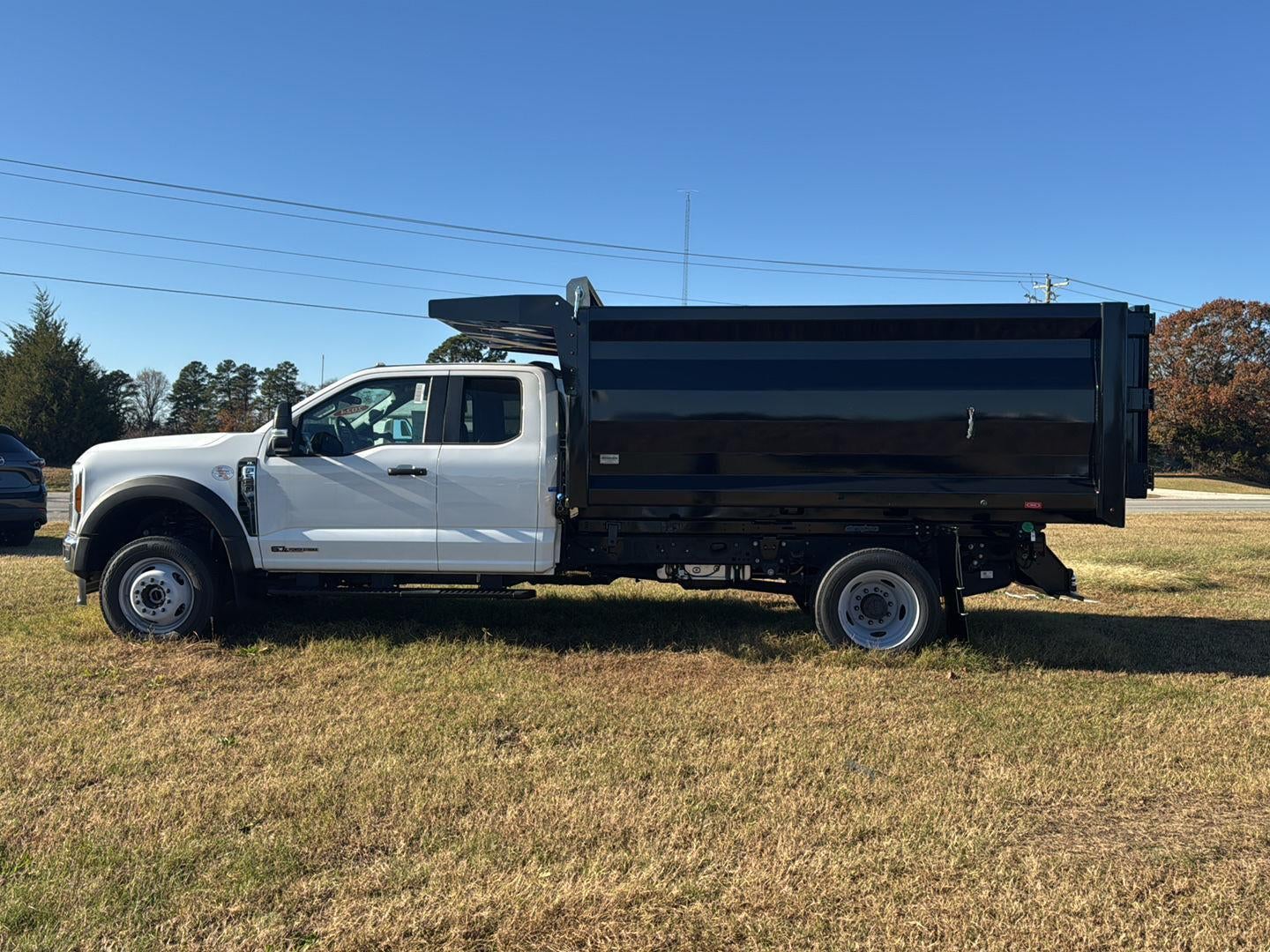 2024 Ford Super Duty F-550 DRW 12' RUGBY HEAVY DUTY STAKELESS LANDSCAPE BODY, 48" BARN DOORS, MANUAL TARP, 36' FULL CAB SHIELD, DROP DOWN COMBO HITCH 2 5/16"